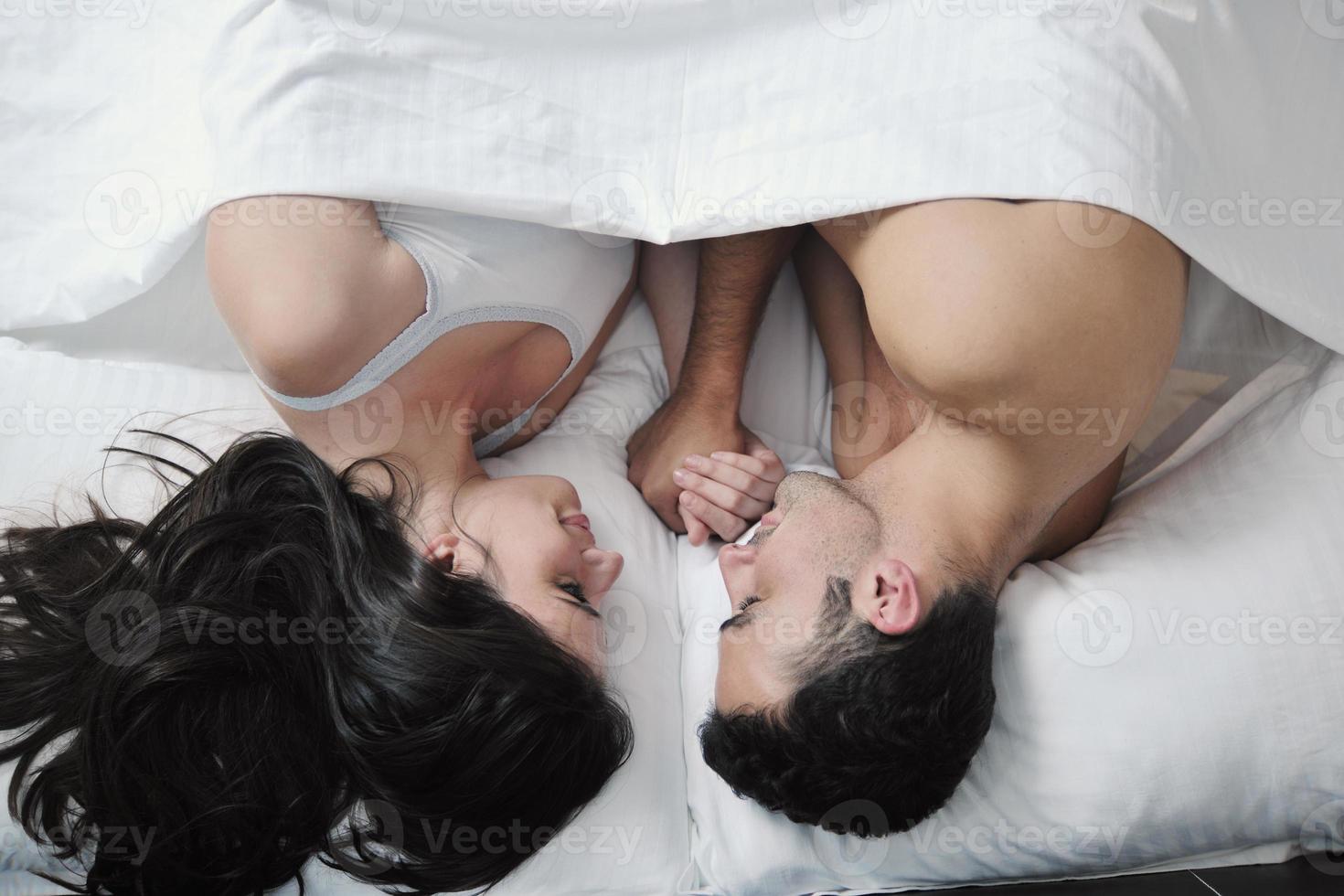 young couple have good time in their bedroom photo