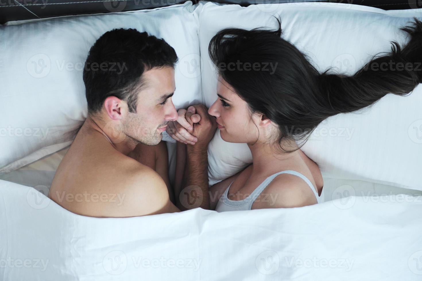 young couple have good time in their bedroom photo