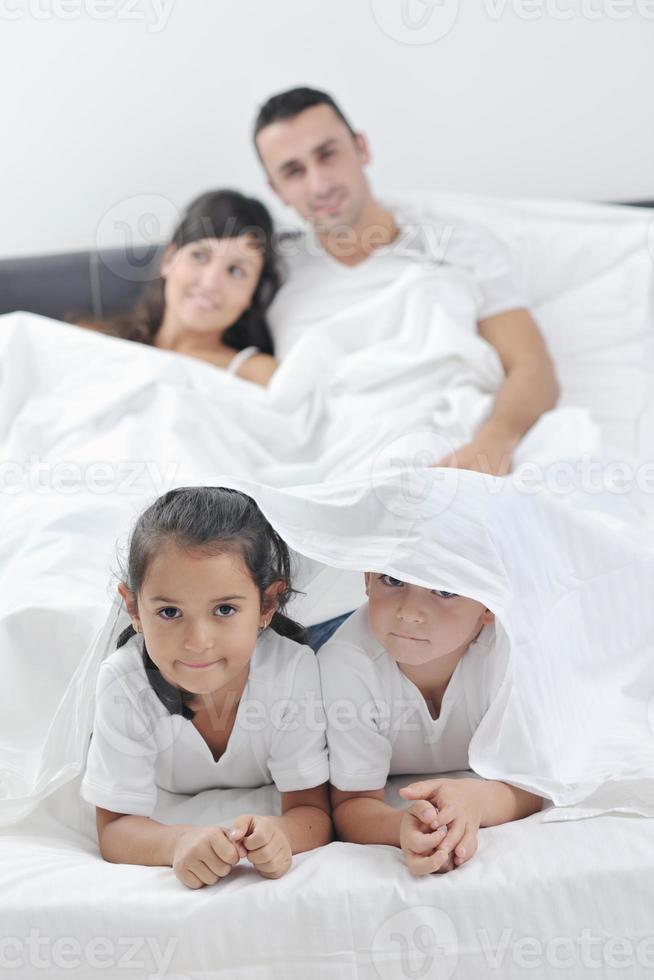 happy young Family in their bedroom photo