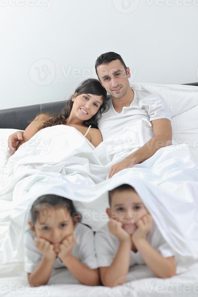 happy young Family in their bedroom photo