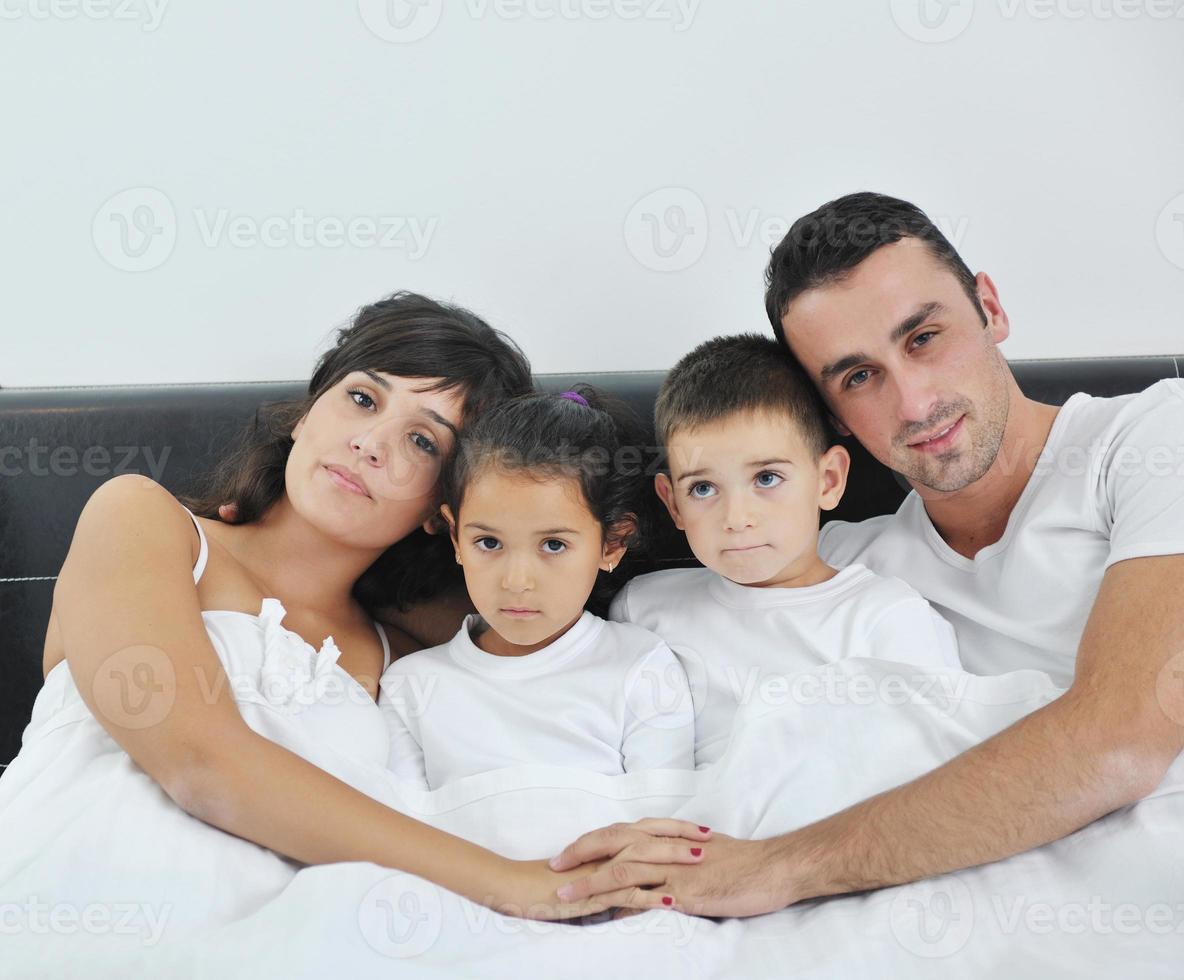 happy young Family in their bedroom photo