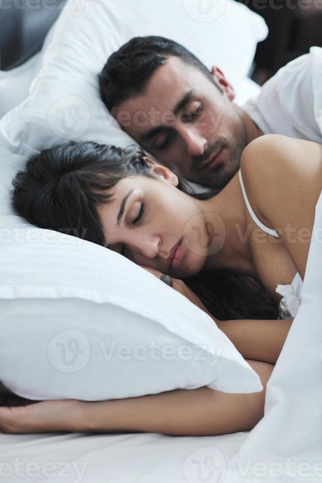 young couple have good time in their bedroom photo