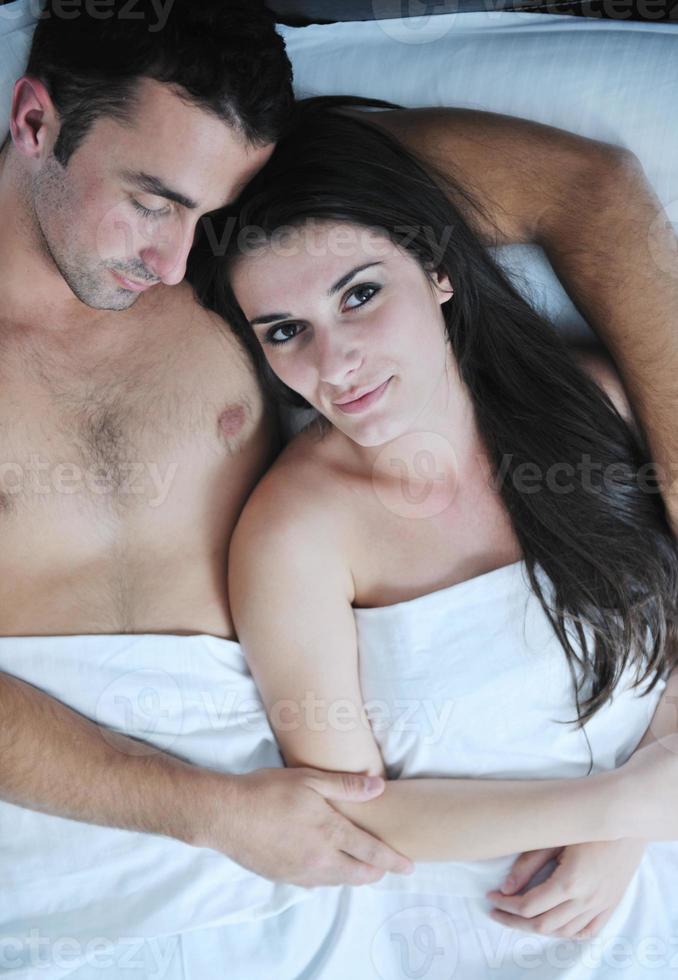 young couple have good time in their bedroom photo