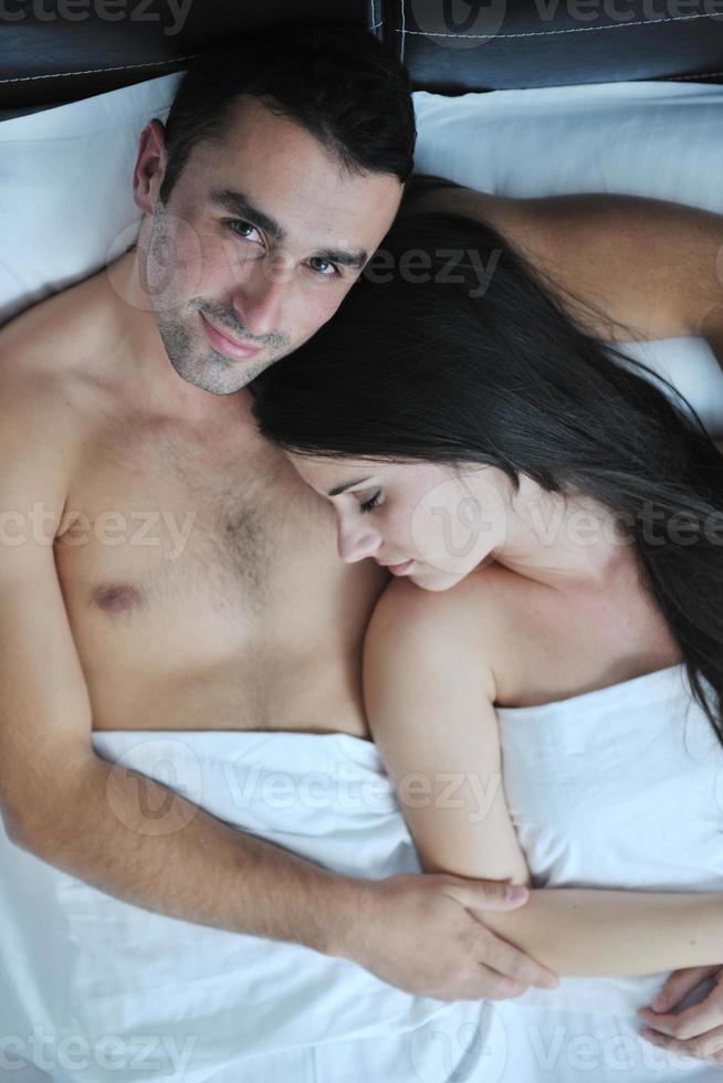 young couple have good time in their bedroom photo