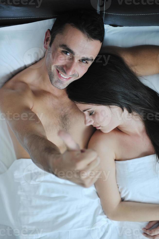 young couple have good time in their bedroom photo