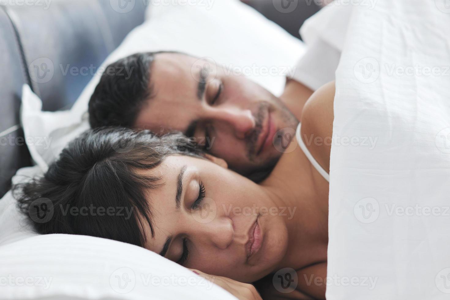 young couple have good time in their bedroom photo