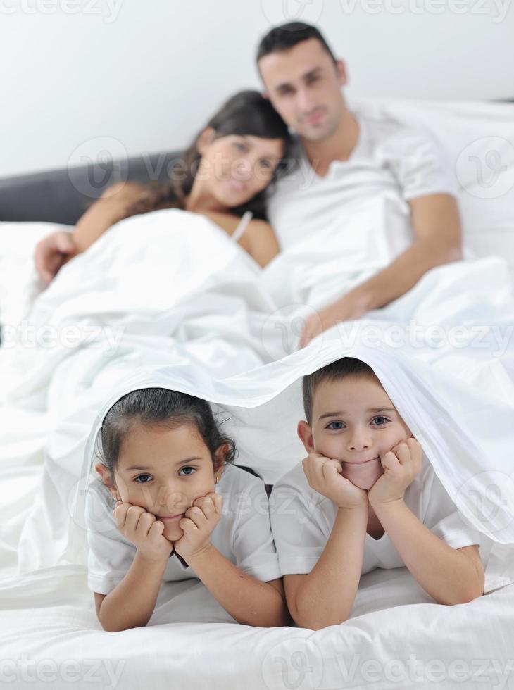 happy young Family in their bedroom photo