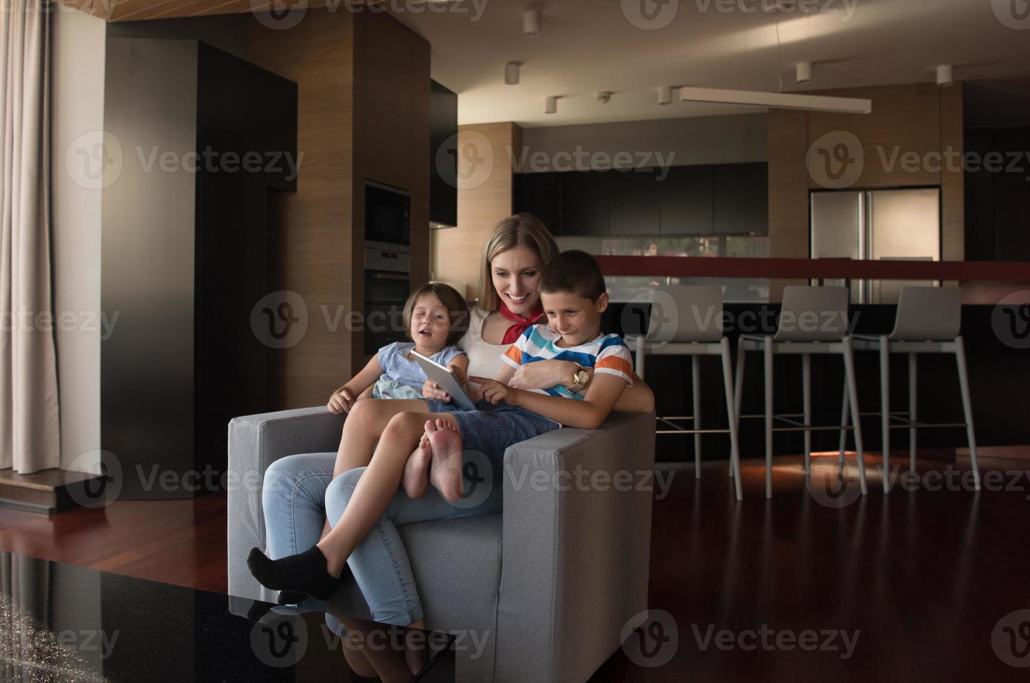happy young mother spending time with kids photo