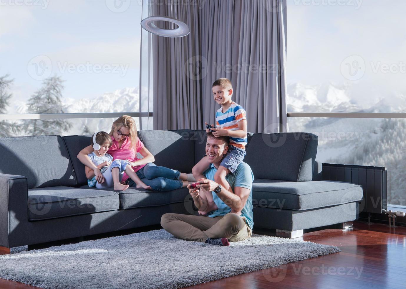 Happy family playing a video game photo