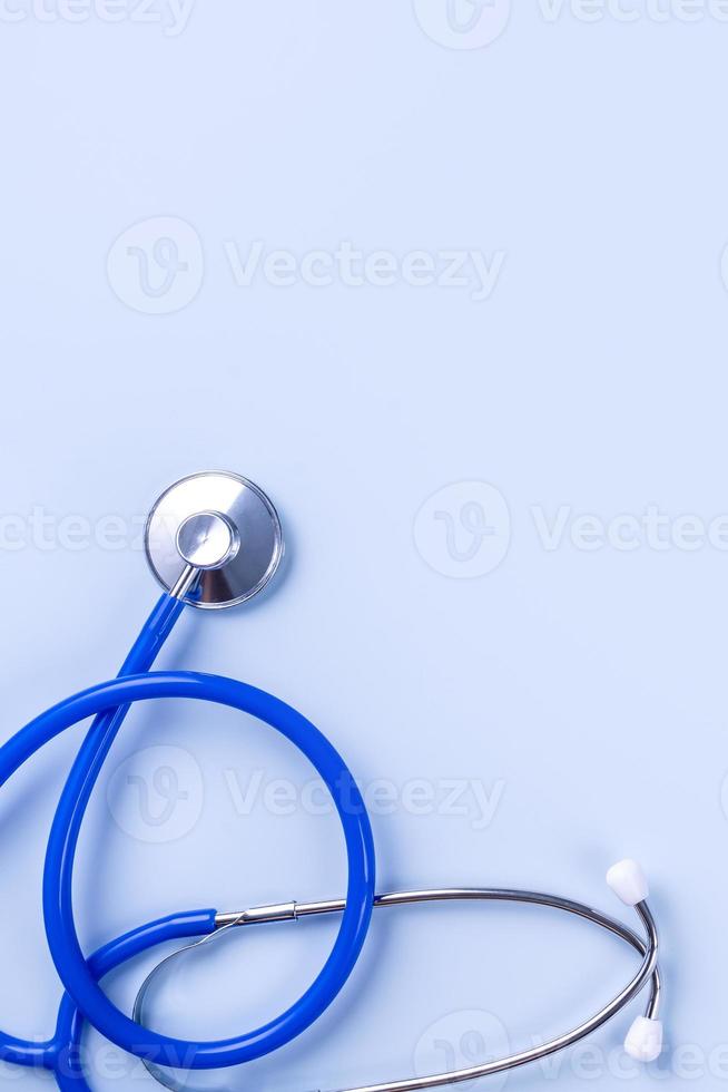 Blue mask - medical equipment with stethoscope, concept of world disease pandemic infection and prevention, top view, flat lay, overhead design photo