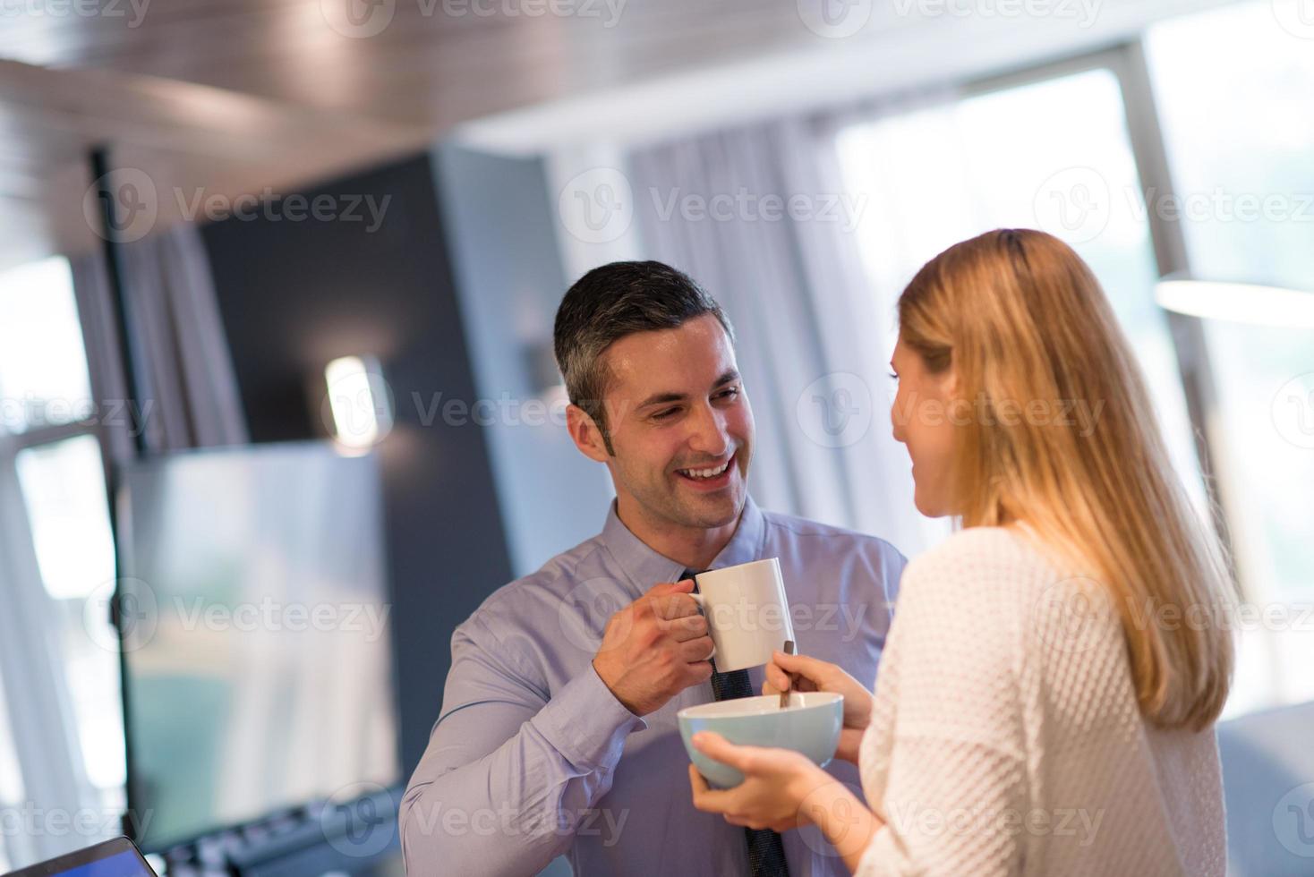 A young couple is preparing for a job and using a laptop photo