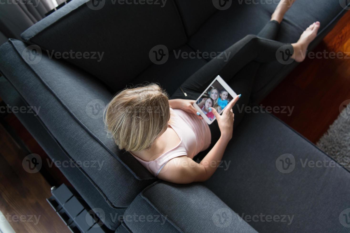 woman using tablet in beautiful apartment photo