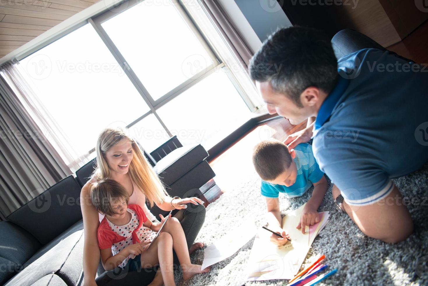 young couple spending time with kids photo