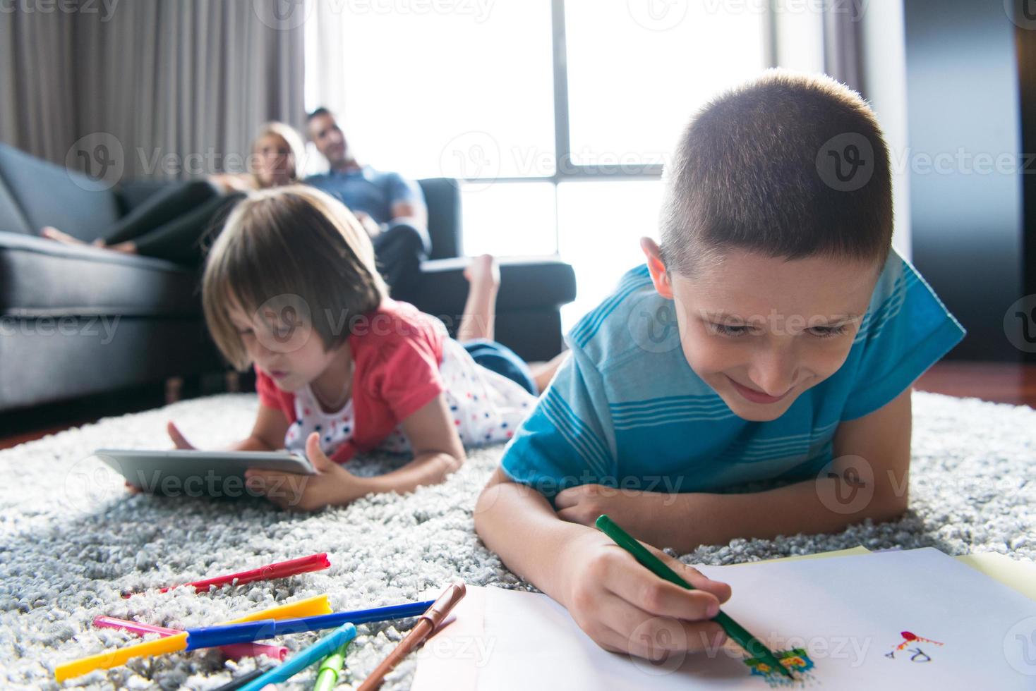 young couple spending time with kids photo