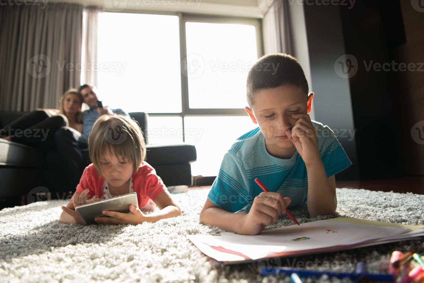 young couple spending time with kids photo