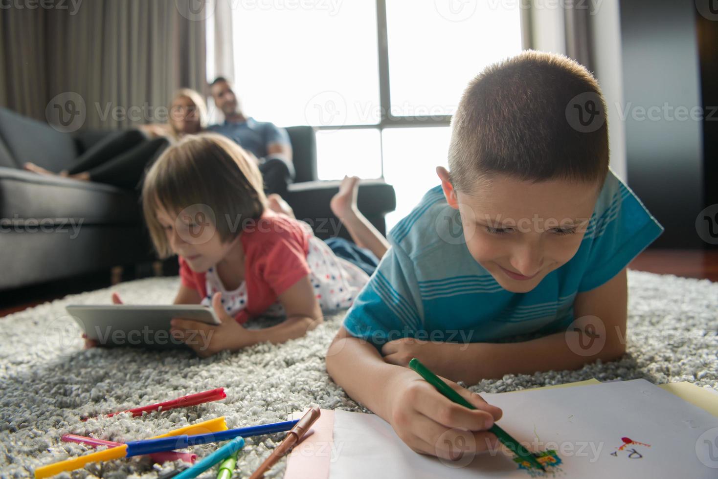 young couple spending time with kids photo