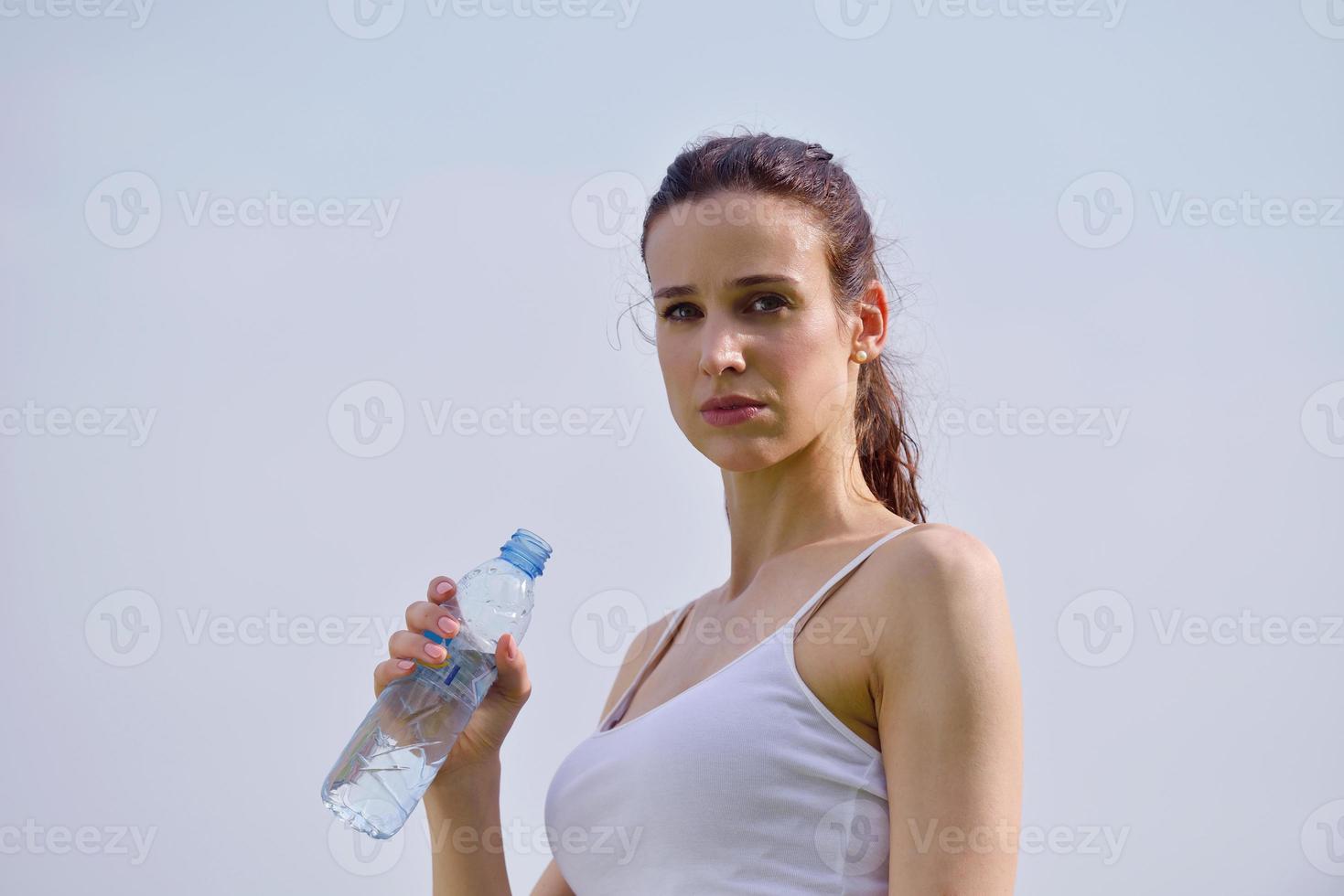 Young beautiful woman drinking water after fitness exercise 10800113 Stock Photo at Vecteezy