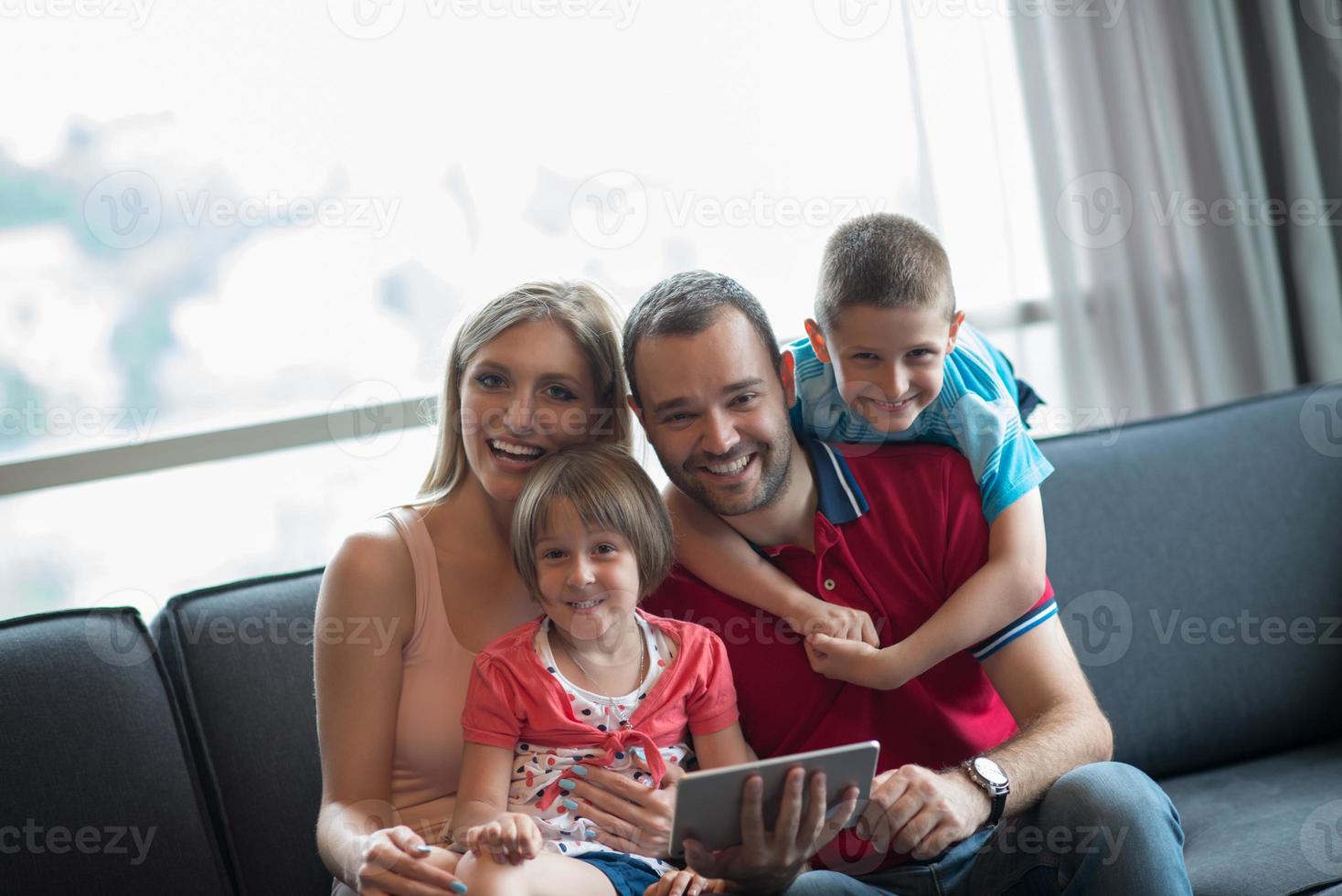 happy young couple spending time with kids photo