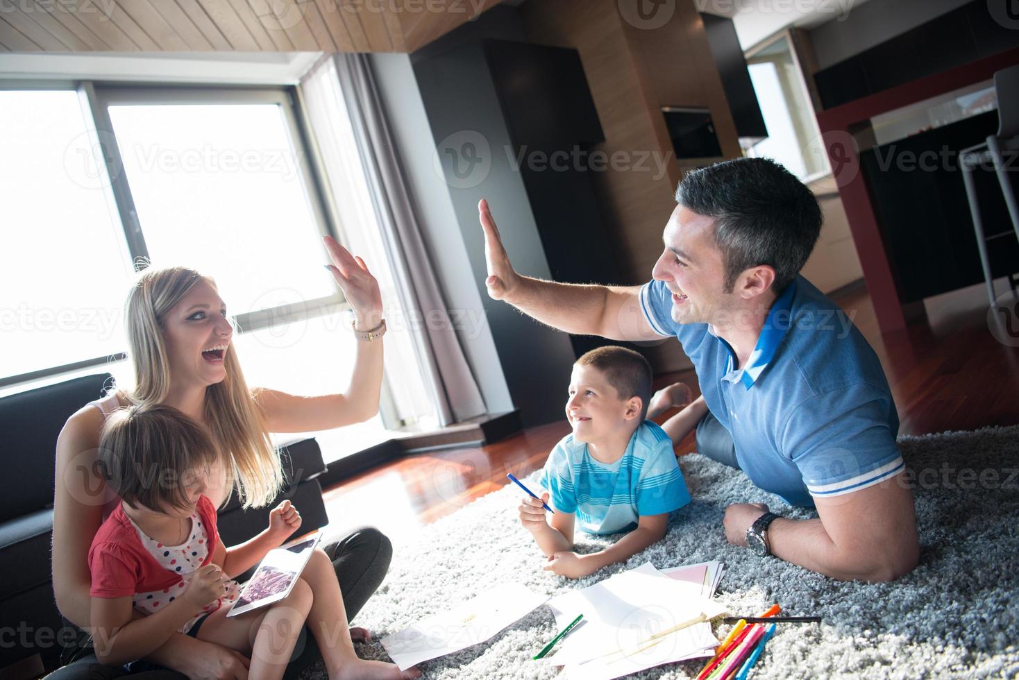 young couple spending time with kids photo