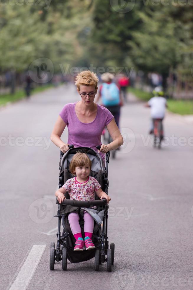 mom with baby stroller jogging photo