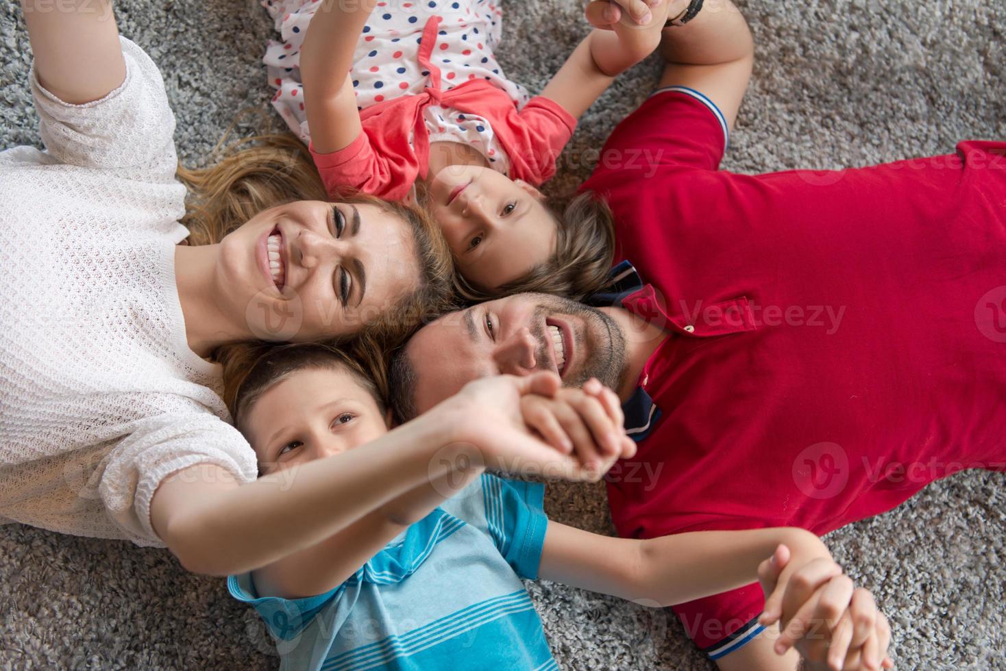 happy family lying on the floor photo