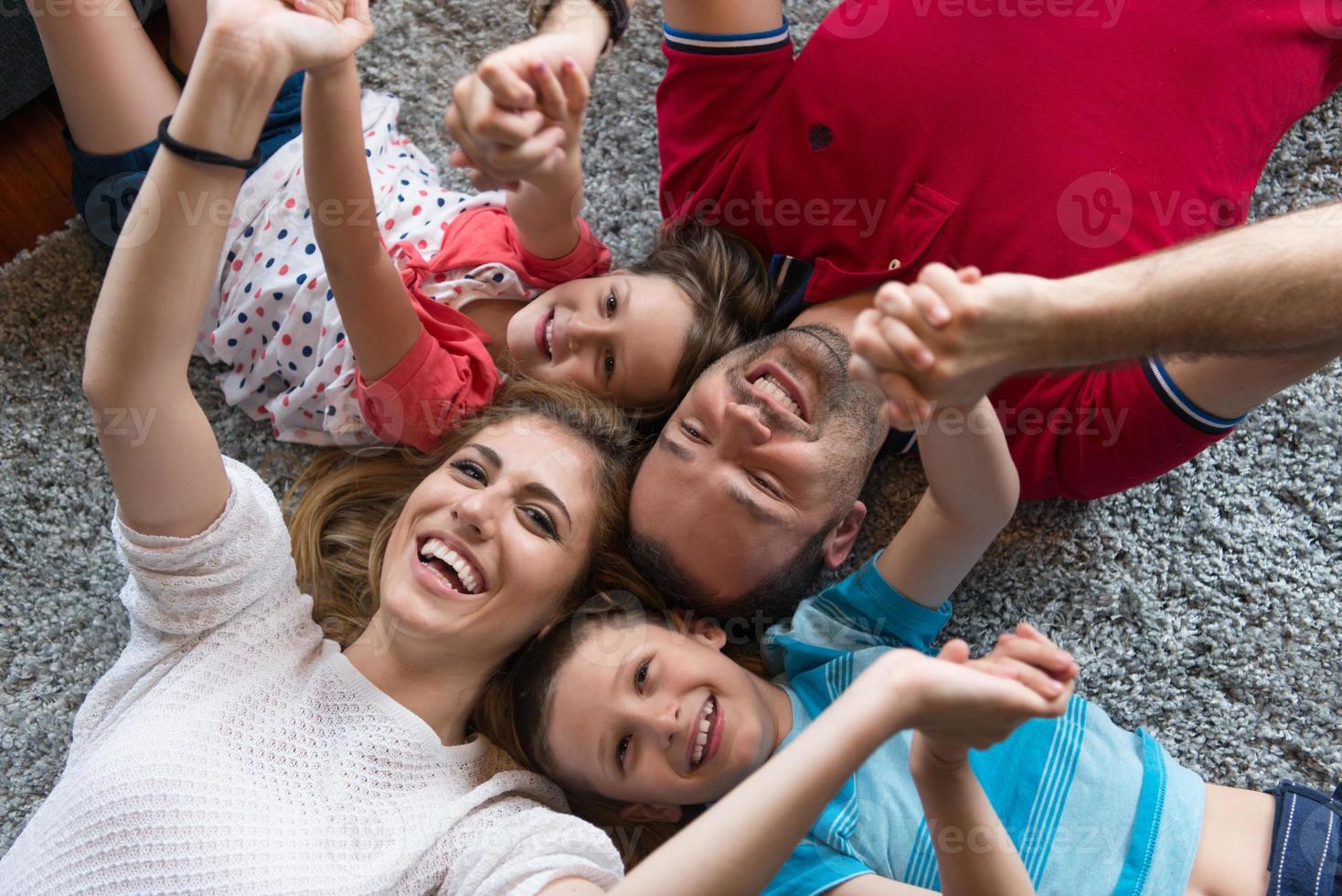 happy family lying on the floor photo