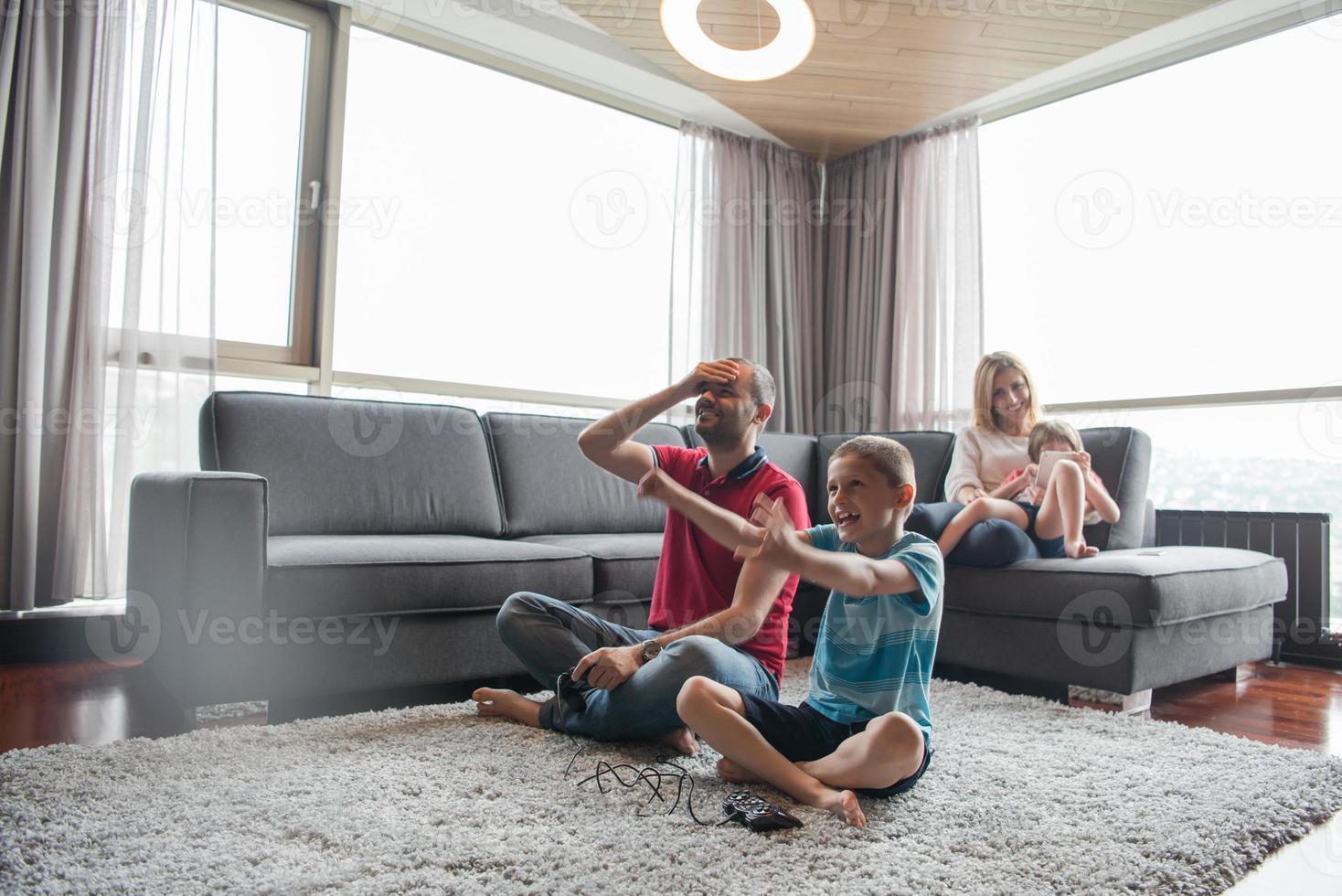 Happy family playing a video game 10801247 Stock Photo at Vecteezy