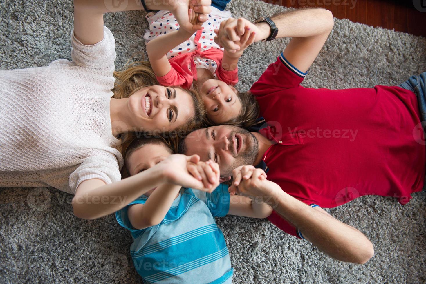 happy family lying on the floor photo