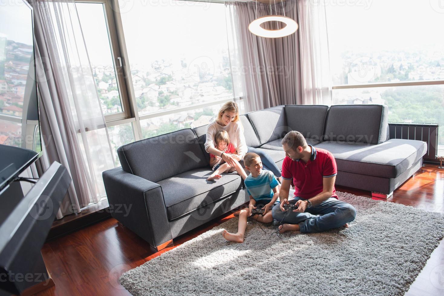 Happy family playing a video game 10801268 Stock Photo at Vecteezy