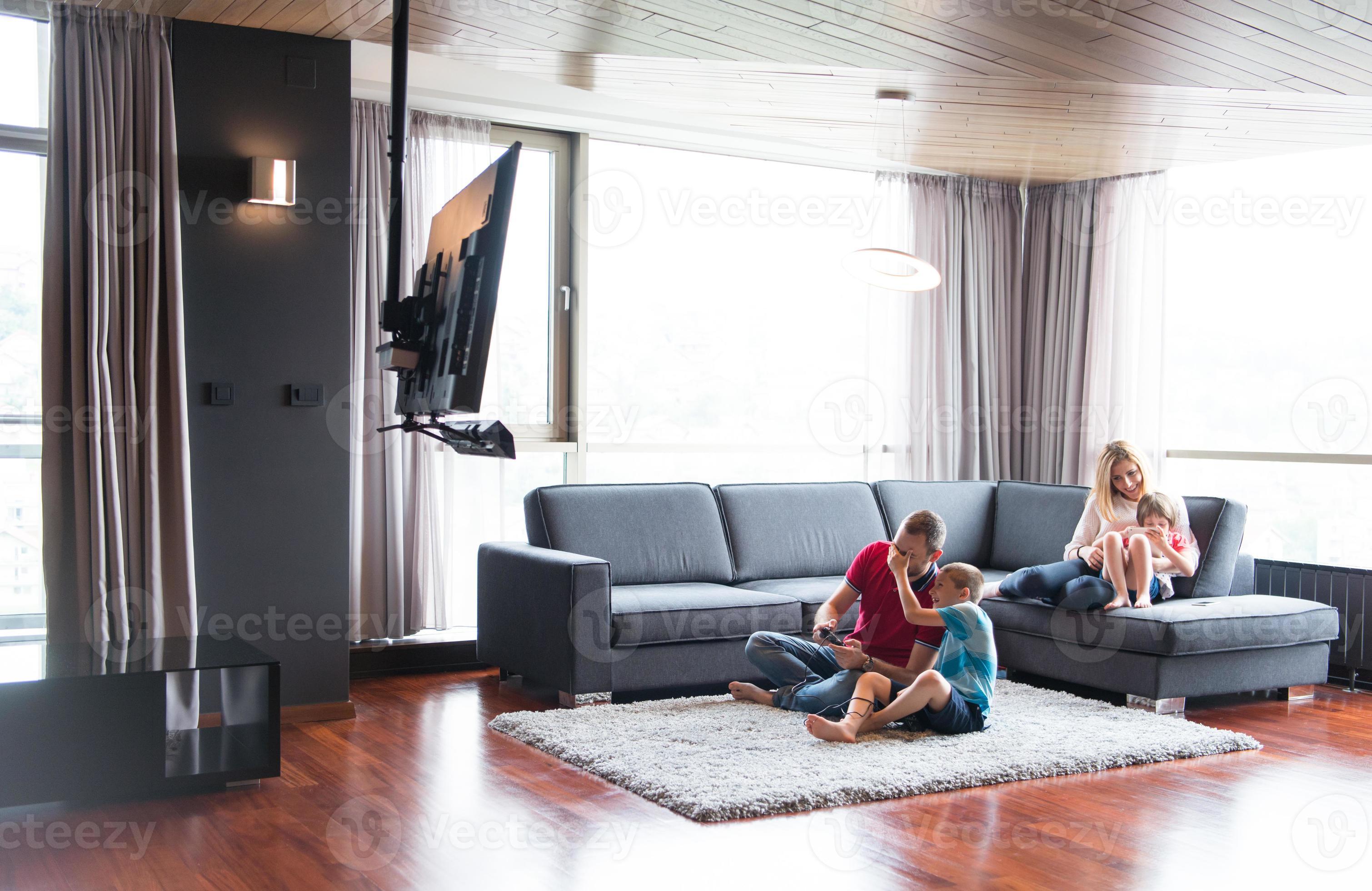 Happy family playing a video game 10801275 Stock Photo at Vecteezy
