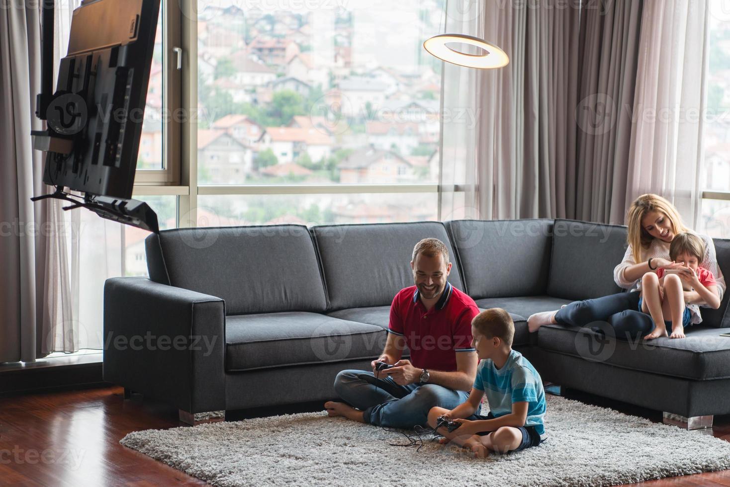 Happy family playing a video game photo