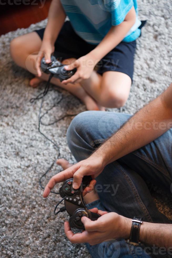 Happy family playing a video game photo