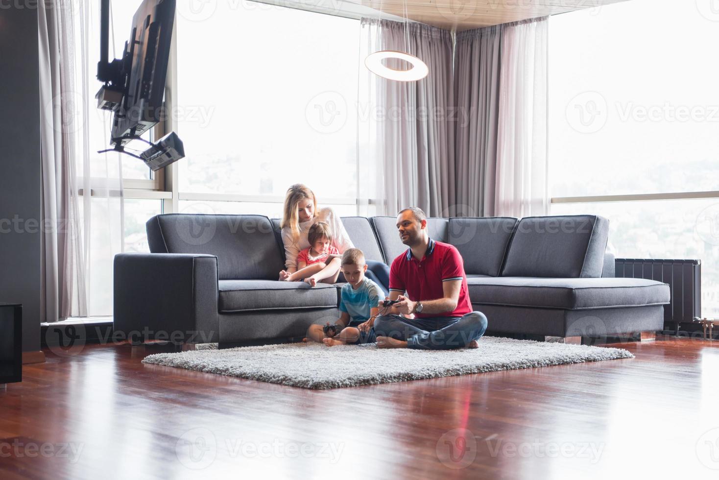 Happy family playing a video game 10801296 Stock Photo at Vecteezy
