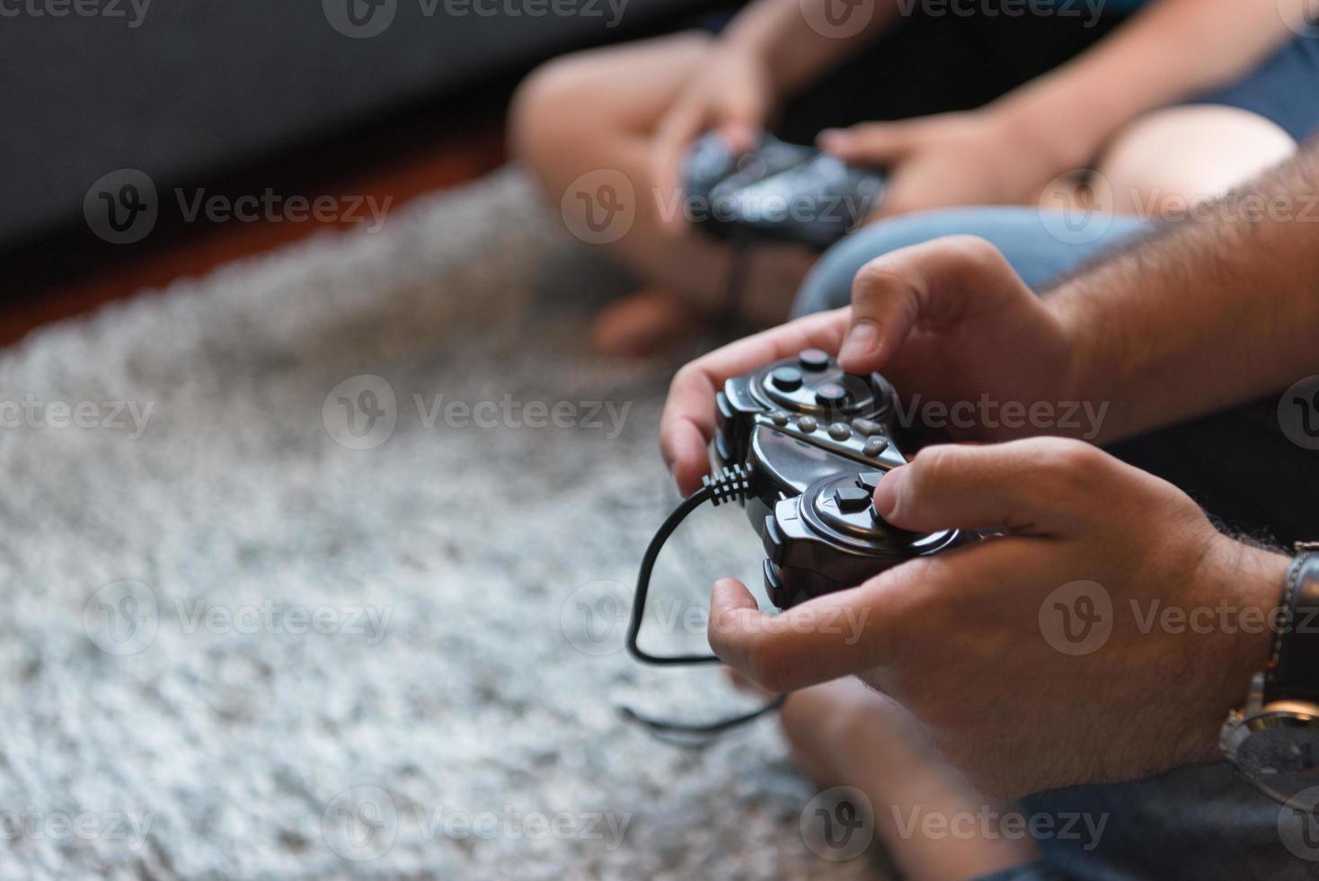 Happy family playing a video game photo