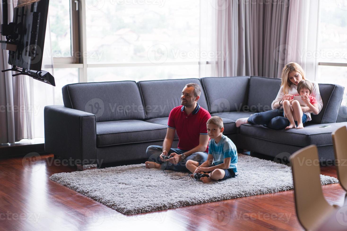 Happy family playing a video game 10801841 Stock Photo at Vecteezy