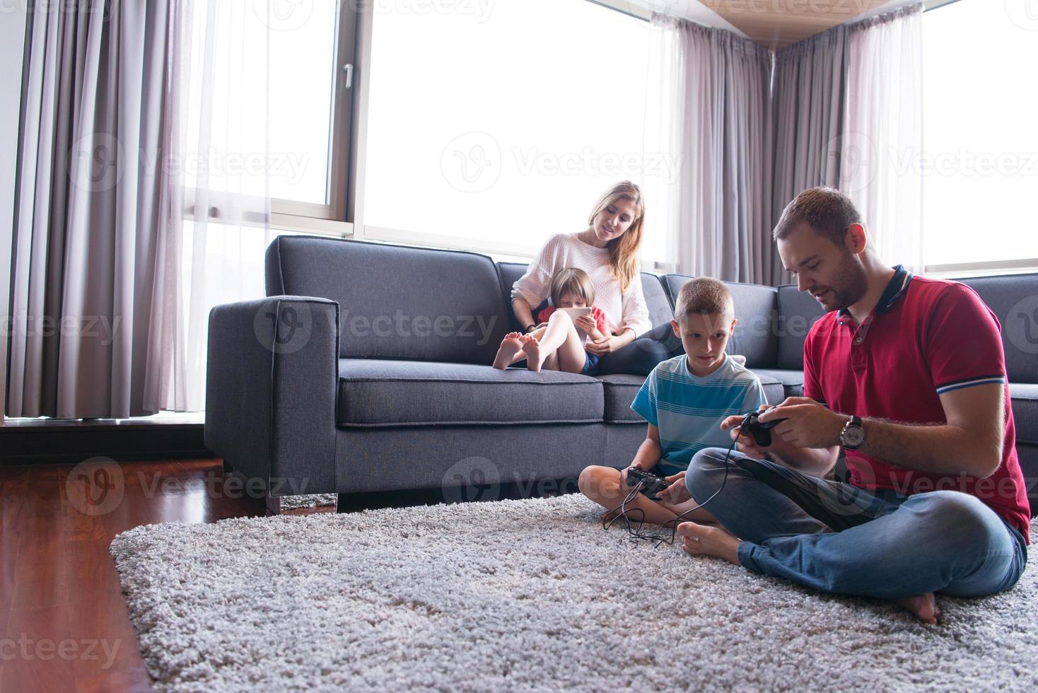 Happy family playing a video game 10801857 Stock Photo at Vecteezy