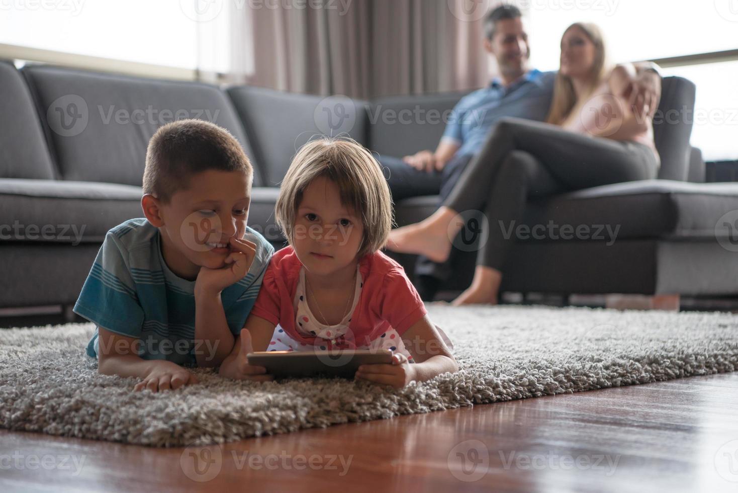 couple spending time with kids photo