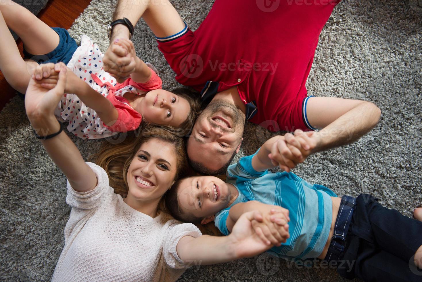 happy family lying on the floor photo