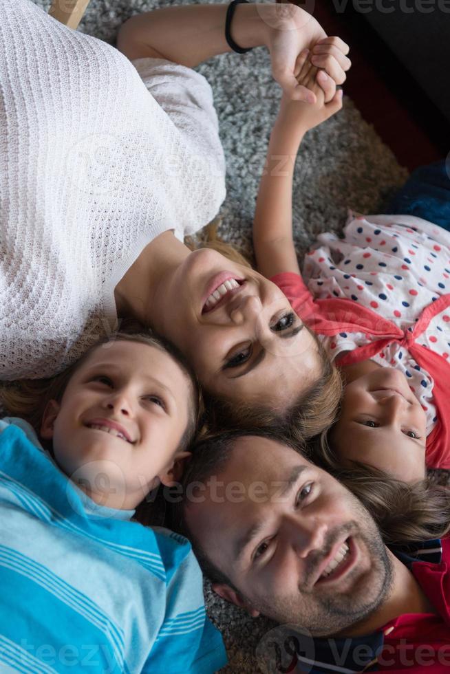 happy family lying on the floor photo