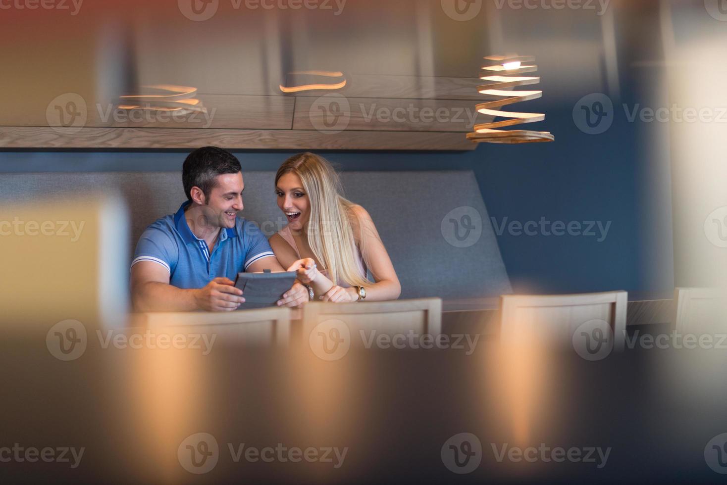 couple using tablet at home photo