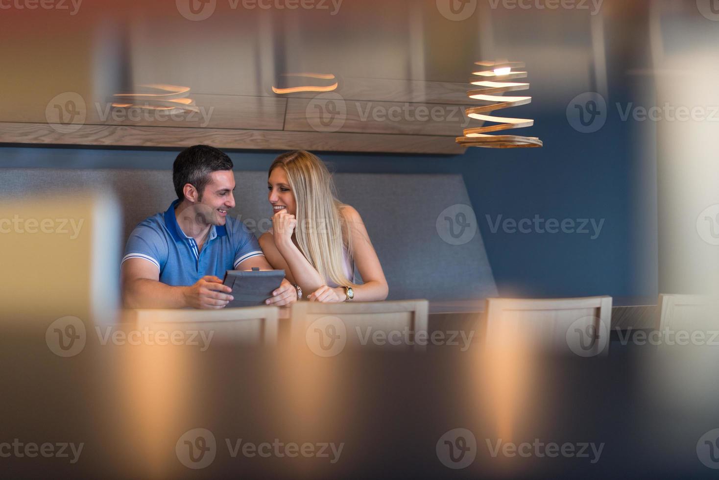 couple using tablet at home photo