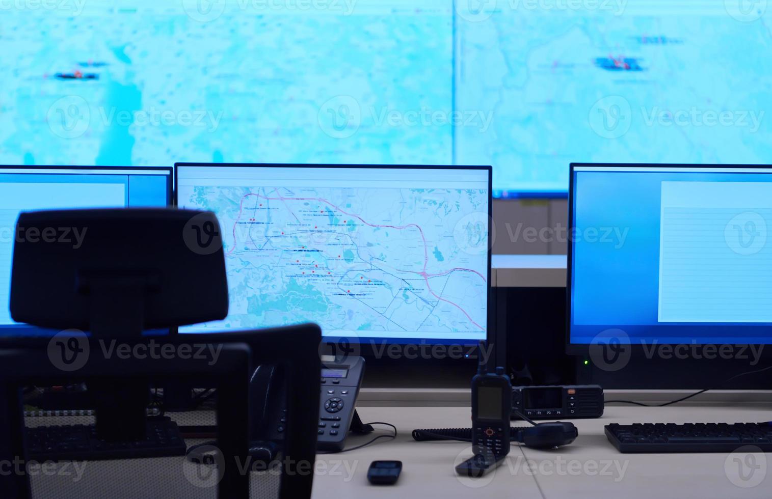 Empty interior of big modern security system control room photo