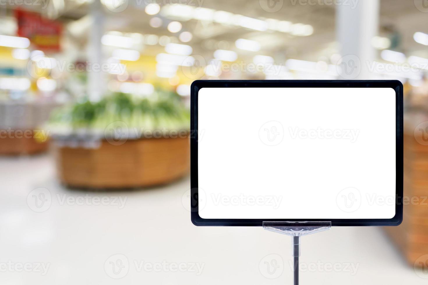 Blank price board with fresh food in supermarket photo