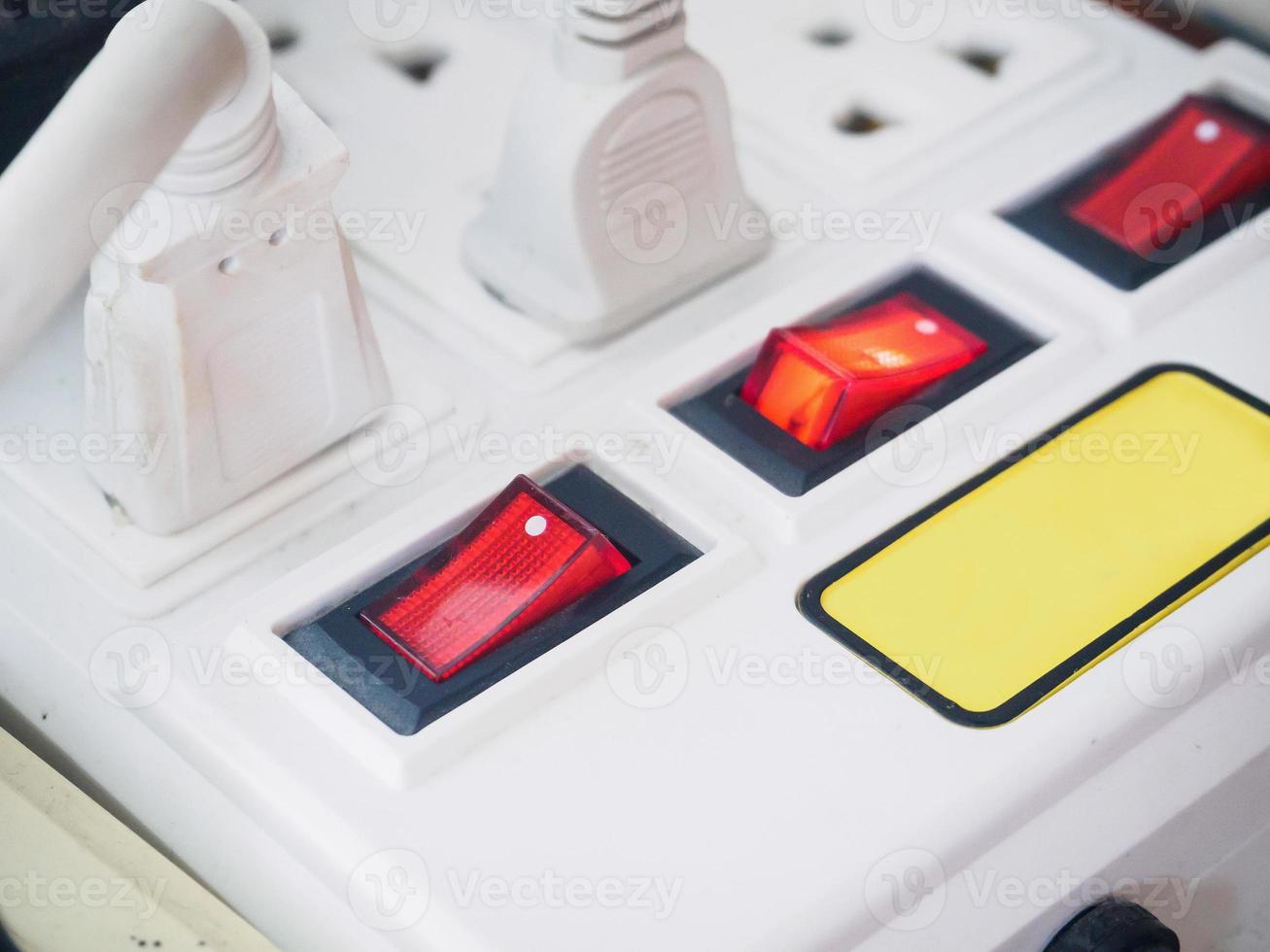 Multiple power socket with connected plugs photo