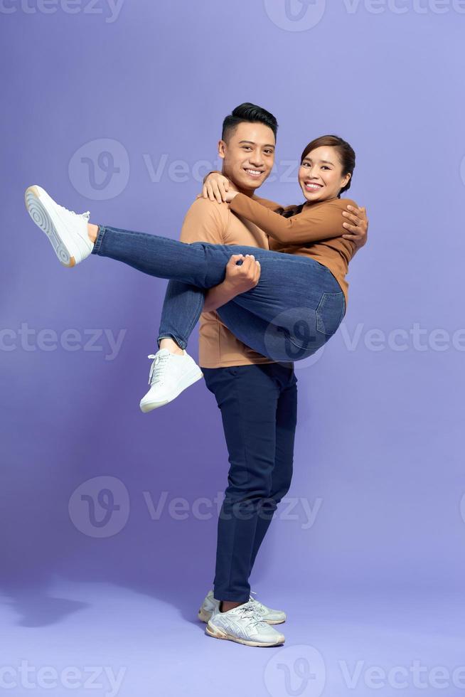 Man holding woman on hands photo