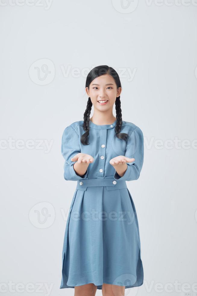 woman showing open hand for product or something portrait on white background photo