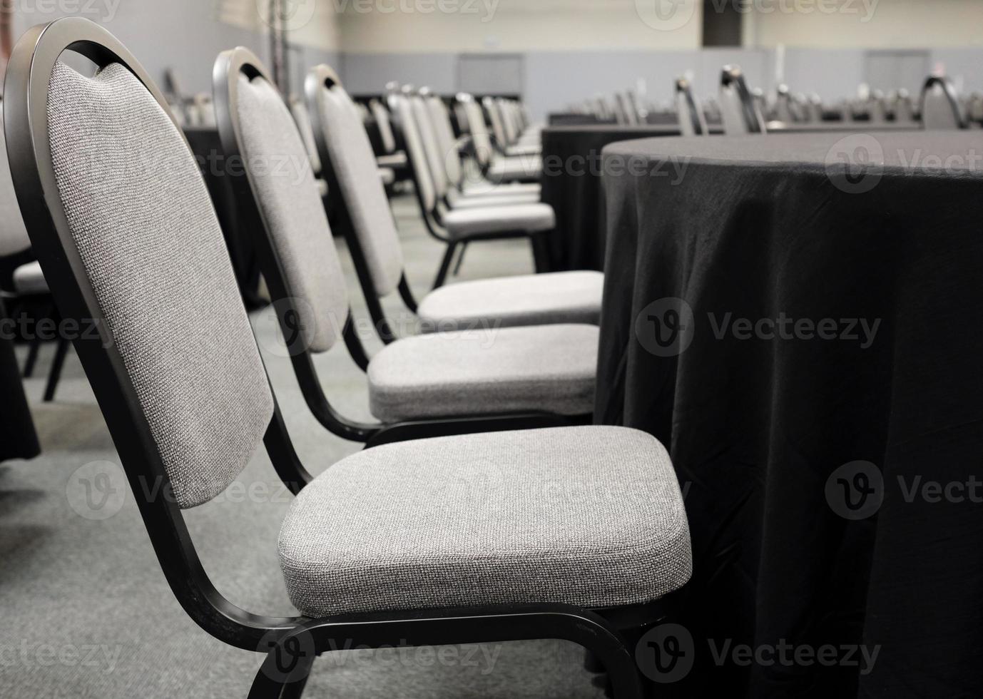 Rows of empty rooms in a big conference room photo