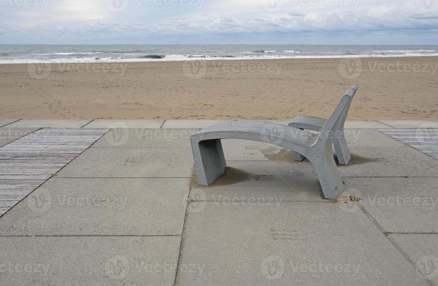 Two concrete benches at the coast of the Netherlands in Scheveningen near The Hague photo