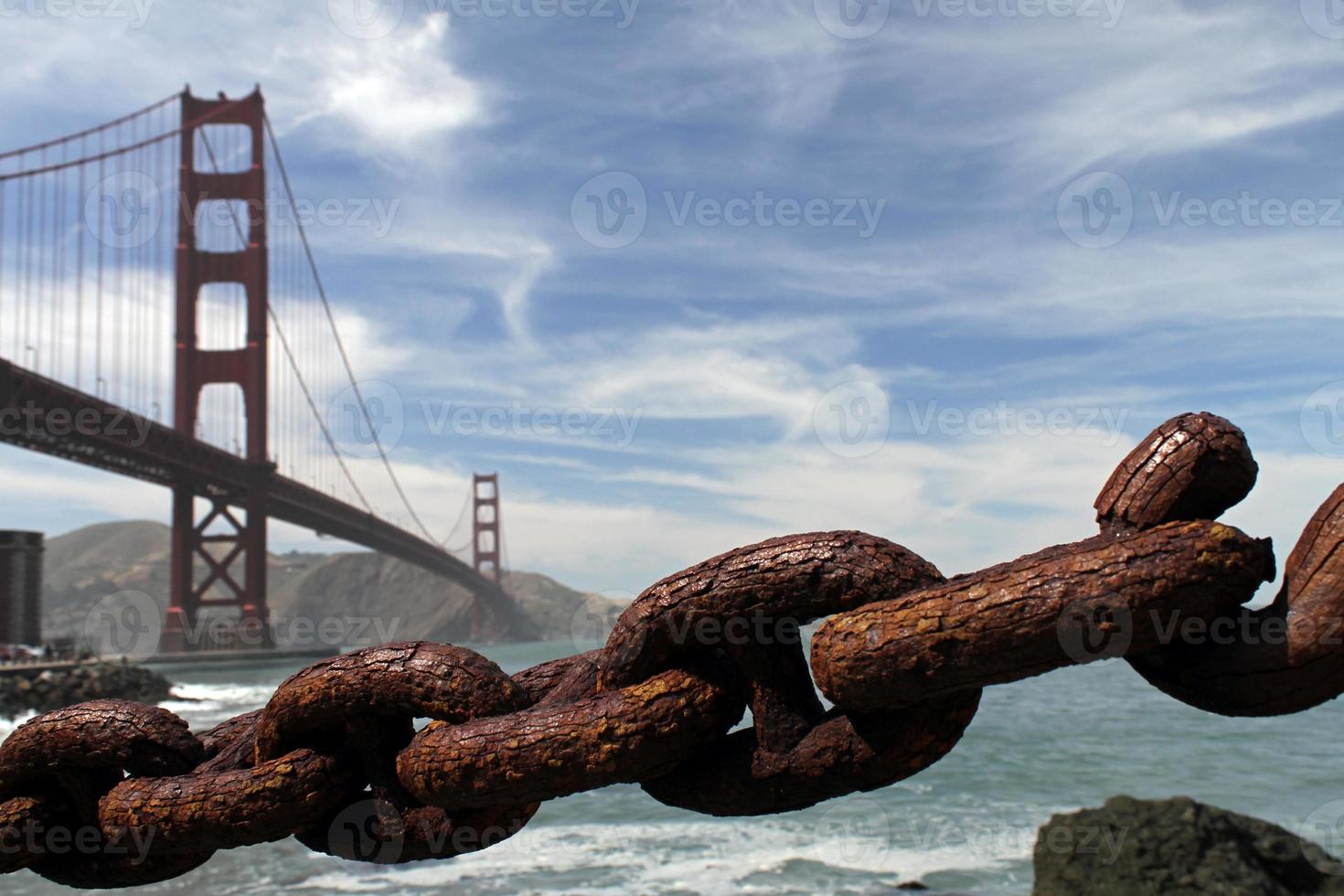 Rusty chain with Golden Gate Bridge in the background photo