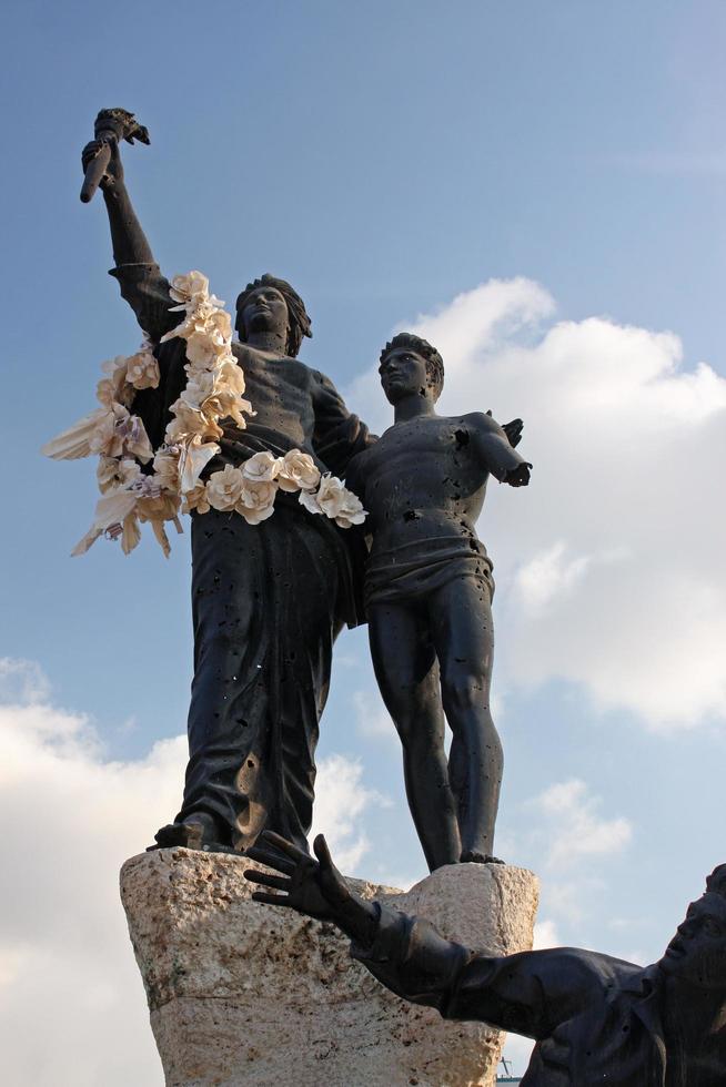 Beirut, Lebanon, 2018 - The statue of the Martyrs was created by Marino Mazzacurati. The restoration intentionally preserved the marks of war damage photo